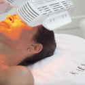 Woman receiving LED light therapy at Kaelon Beauty